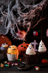 Obraz na płótnie Canvas Brownie with ghosts of meringue as the idea of a dessert for Halloween