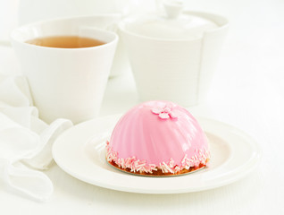 A cake in the form of a heart. Valentine's Day.