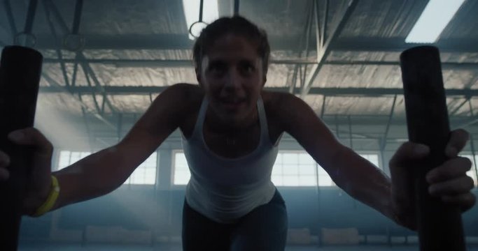 fitness woman training bodybuilding workout muscular sportswoman exercise using weights enjoying strength challenge in gym fierce female athlete practice healthy lifestyle