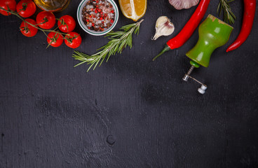  Ingredients for Cooking Vegetables,Tomatoes,Peppers,Garlic,Rosemary on a on Black Background, top...