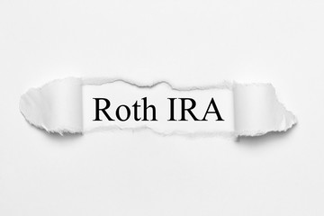 Roth IRA on white torn paper
