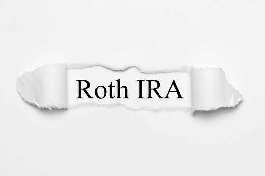 Roth IRA On White Torn Paper