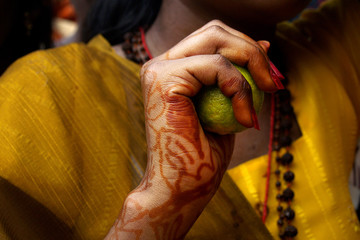 Hand with henna tattoo of pelgrim during ceremony of  thaipusam festival, at Batu cave, Kuala...