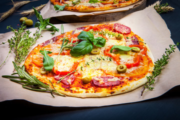 Delicious fresh pizza on dark