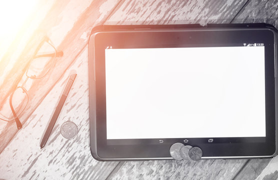 The graph of income growth. Electronic tablet with a graph of gr