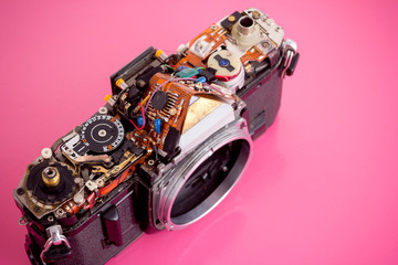 The old film camera washes out the parts on pink background.