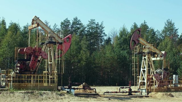 Extraction of petroleum by Pumpjacks on an oil well in Russia
