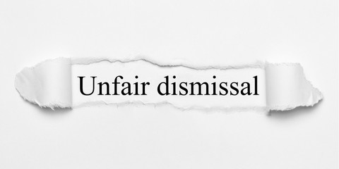 Unfair dismissal on white torn paper