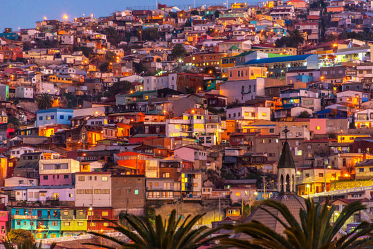 Colorful houses illuminated at night on a hill of Valparaiso, Chile