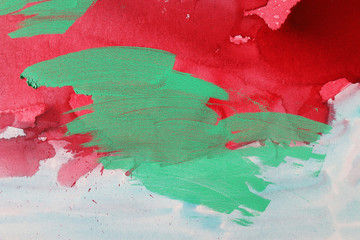Green, red and blue color abstract art background. Acrylic dye on canvas. Soft brushstrokes of paint. 