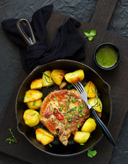 Fried pork steak with broccoli and onion sauce.
