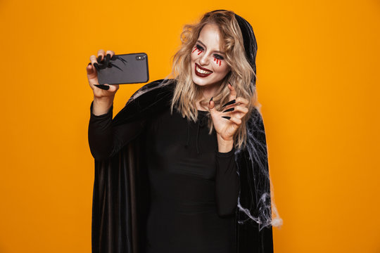 Pretty lady witch making selfie on smartphone isolated