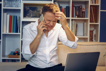 Businessman has unpleasant phone conversation with partner. Business concept.