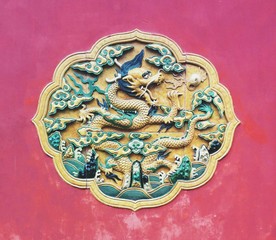 Carving of Dragon on wood panel - China