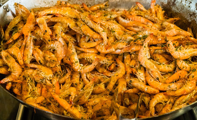 Shrimps fried on pan with herbs