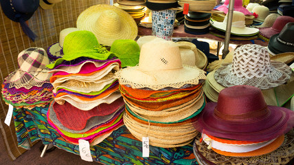 Colorful straw hats in Saint-Pierre's market in Reunion Island