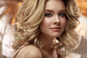 Hair Style And Makeup. Beautiful Blonde Woman With Volume Hair