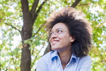 Lovely Young African American Woman Smiling In Nature
