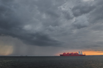 LNG TANKER - Rain and stormy dramatic clouds over a gas terminal in Swinoujscie   © Wojciech Wrzesień