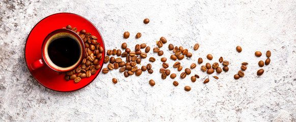 Coffee Beans Fragrant in the Red Cup on the Gray Background. Top View. Copy space for Text.Banner