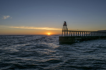 Fototapeta na wymiar Whitby East Pier Sunrise