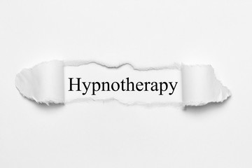 Hypnotherapy on white torn paper