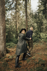 Fototapeta premium Portrait of happy hipster couple kissing and hugging in nature