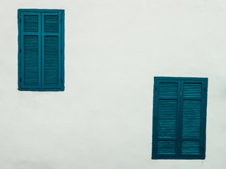 Blue Window Shutters with white wall