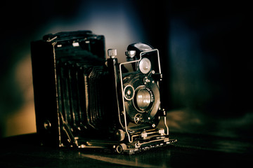 very old black retro camera, retro toned
