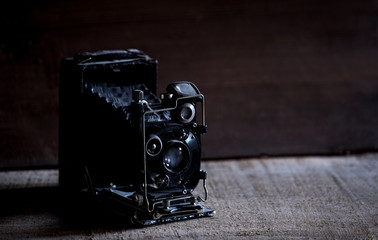very old black retro camera, retro toned
