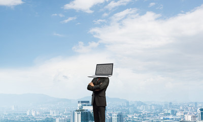 Businessman with laptop instead of head.