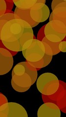 Multicolored translucent circles on a dark background. Vertical image orientation. 3D illustration
