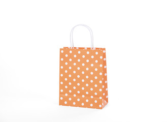 Blank orange paper bag for mockup template advertising and branding isolated on white background.