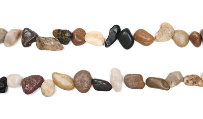 Colorful, decorative pebbles, rocks isolated on white background, top view