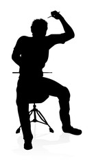 A drummer musician drumming drums in detailed silhouette