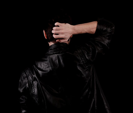 The Man Is Facing Backwards And Looking At Something And Black Background