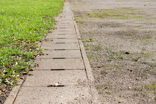 Concrete drainage covered by lids