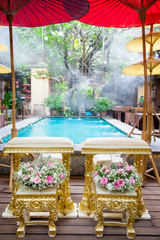 Thai wedding accessory for cultural wedding ceremony, luxury chair for bride and groom, golden tray with pedestal and the others. image for wedding objects, copy space and advertisement.