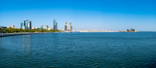 Naklejka premium Baku, Azerbaijan - September 26, 2018. Panoramic view of skyline in Baku, Azerbaijan, with historic and modern architecture. Blue Caspian Sea Panorama