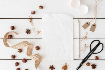 White paper bag for recipe.Vintage. Ingredients for pastry on the white table.Flat lay, top view with copy space for your text, lettering or recipe.Background for food bloggers, headers and magazines.