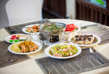 Tradition food. on a wooden table, Set of Thai food popular menu. radition lunch or dinner.Thai food concept Spicy Paste Dip Nam Prik Asian style banquet.Thai traditional Kantoke set.