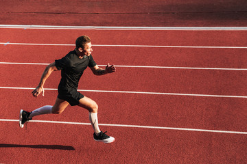 Young sportsman running outdoors