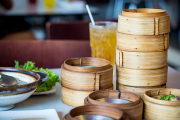 Chinese appetizer, Dimsum, streamed cuisine on bamboo basket container, traditional cuisine