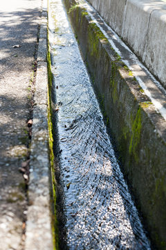 Clean water streaming in concreate made small drainage