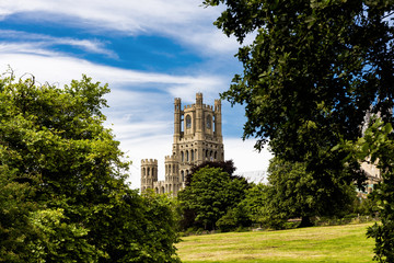 Fototapeta na wymiar The beautiful Ely Cathedral, often know as 'the Ship of the Fens' because of its prominent position above the surrounding flat landscape towers over the streets of the picturesque city of Ely.