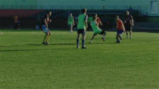Non fair play and foul with tripping for free kick in soccer match, blurred for background