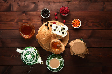 Healthy breakfast. Crispbread, raspberries and honey on the table, wooden background. view from above