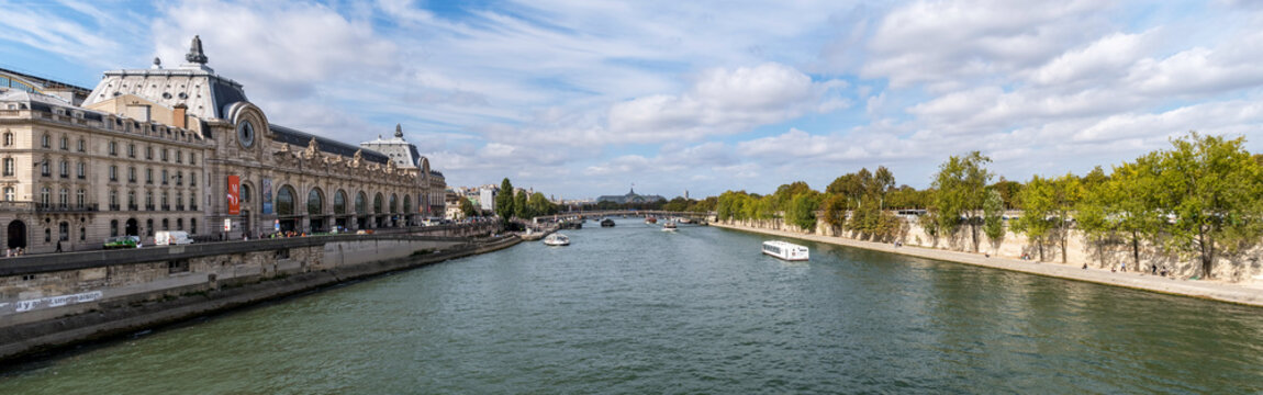 Panoramic view from Pont Royal with view over Seine river, Musee d'Orsay and Grand Palais - Paris, France