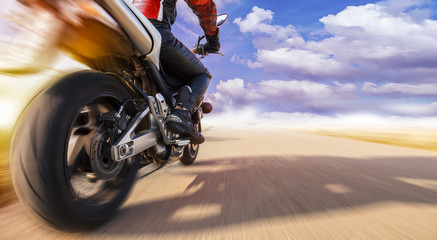 motorcyclist on the highway while overtaking with highspeed. he enjoys an adrenaline rush. © vizualni