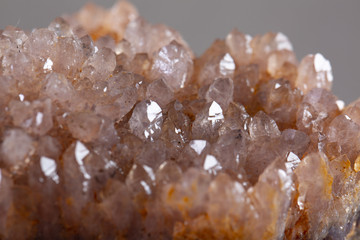 Natural Druse of amethyst on a white background stone